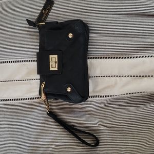 NWT wrist or shoulder bag.  Zippered pockets with seperater in large pocket.
